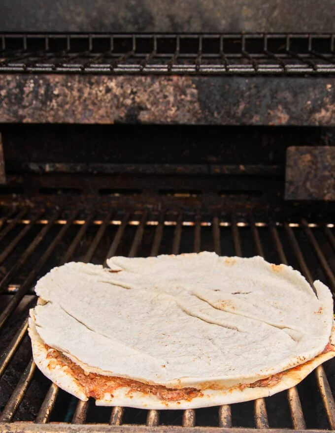 The thin pita on the grill cooking