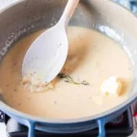 cold butter is added one tablespoon at a time and when dissolved another one is added to make the beurre blanc a success sauce