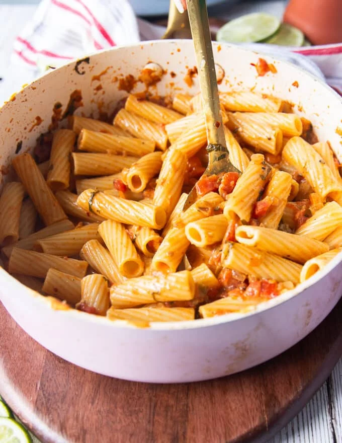 cajun pasta in a pan with the sauce tossed in and ready