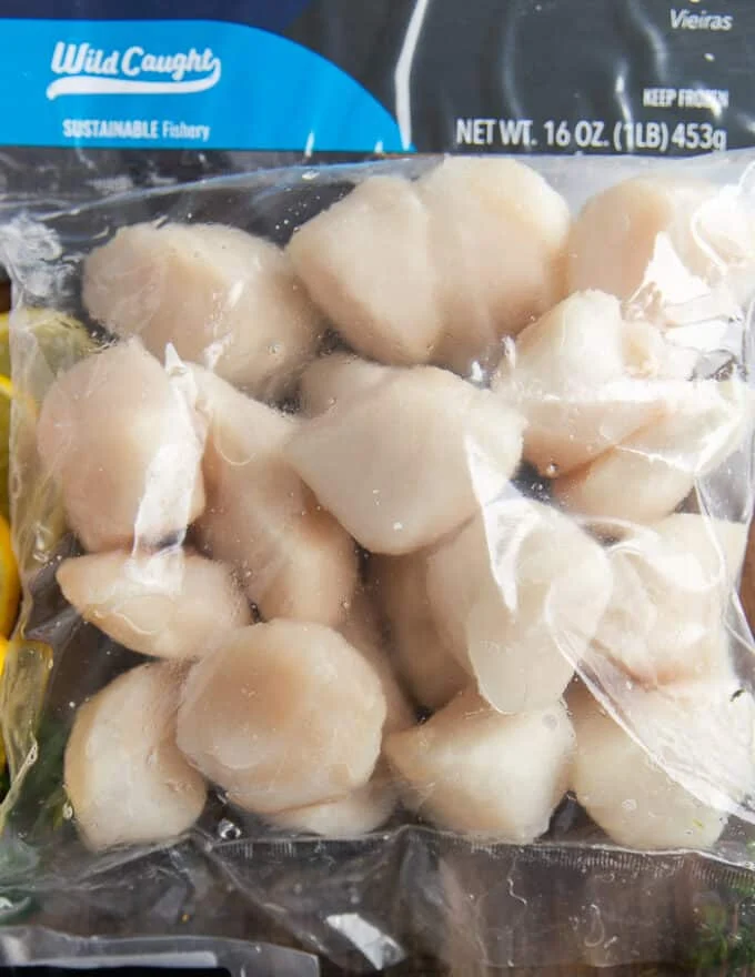 A bag of large plum scallops thawed