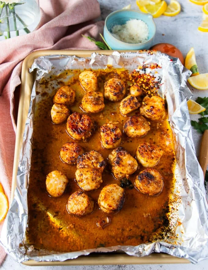 golden brown juicy scallops out of the broiler
