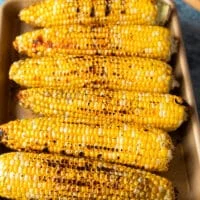 grilled corn on the cob charred and beautiful, ready to slice