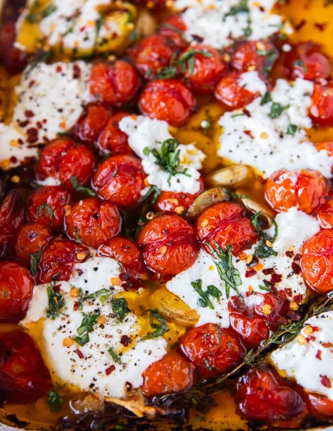 close up of a warm tomato, mozzarella, basil and chilli flakes mixture to spread over the toast