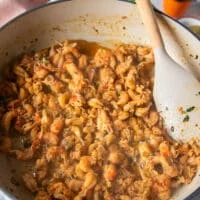 The crawfish tail meat is cooking in the skillet and has absorbed all the flavors