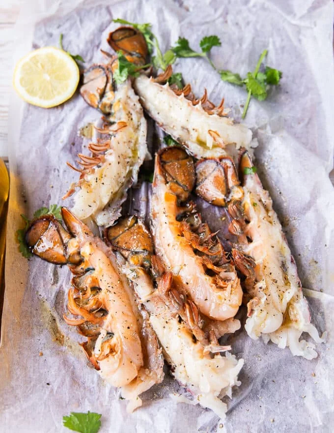 Seasoned lobster tails split and seasoned on both sides