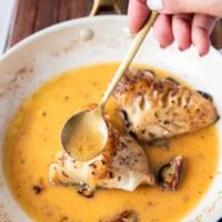basting the fish with hot butter sauce to absorb it fully