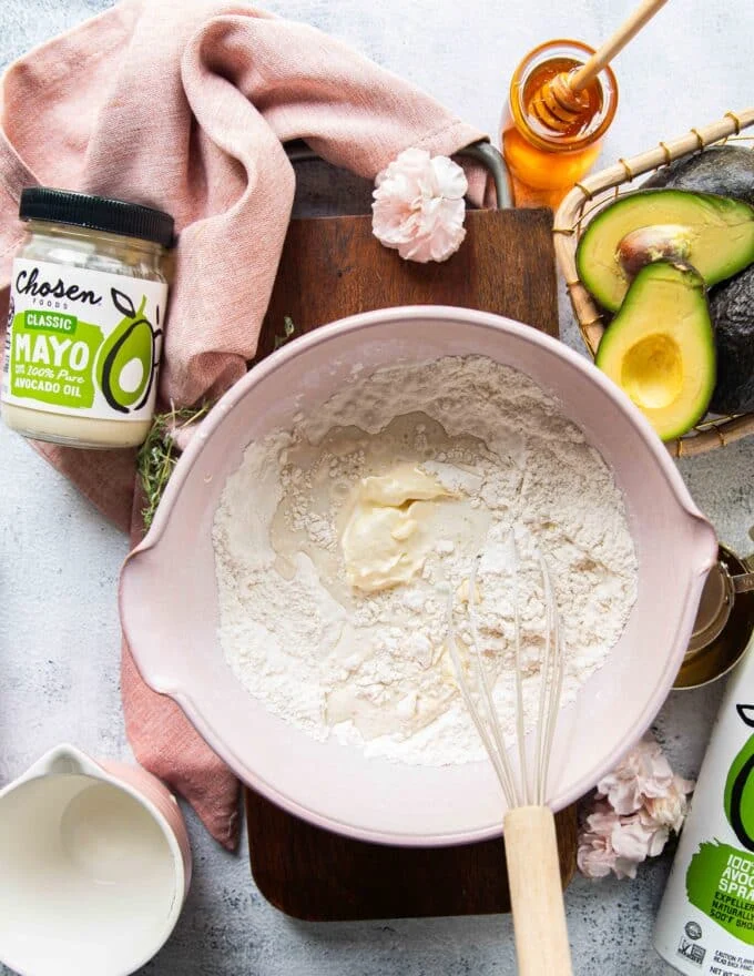 The mayonnaise and milk are added to the flour mixture in the large bowl