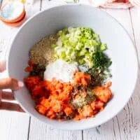 All the salmon burgers ingredients are added into a bowl