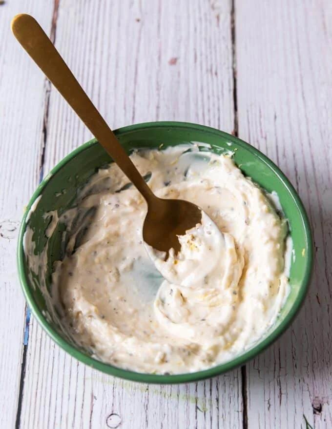 salmon burger sauce , or lemon aioli ready in a bowl