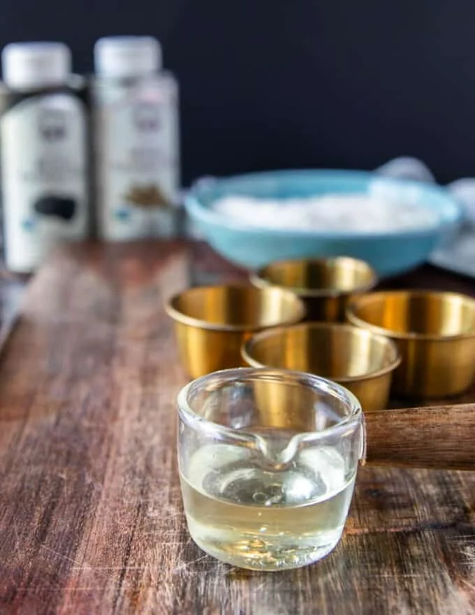 Close up of truffle oil in a glass cup