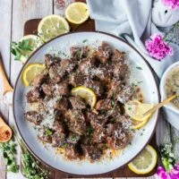 juicy air fryer steak bites with melted butter and parmesan