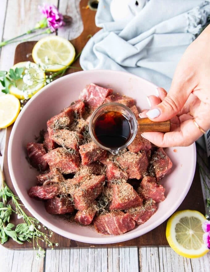 steak bites cut into 1 inch in a bowl with steak seasoning