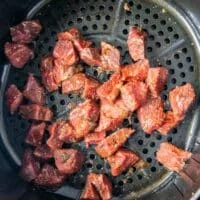 steak bites in an air fryer basket