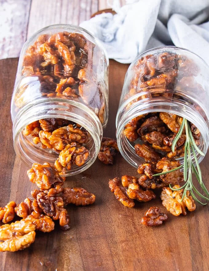 two jars of glossy candied walnuts storing and gifting them