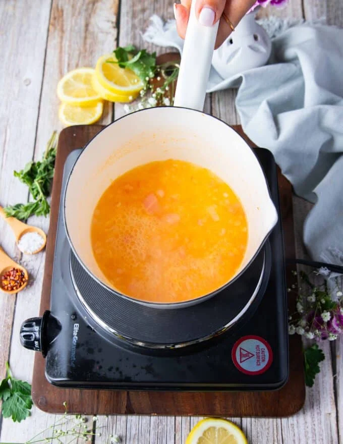 reduced liquid over beurre blanc sauce in a pot