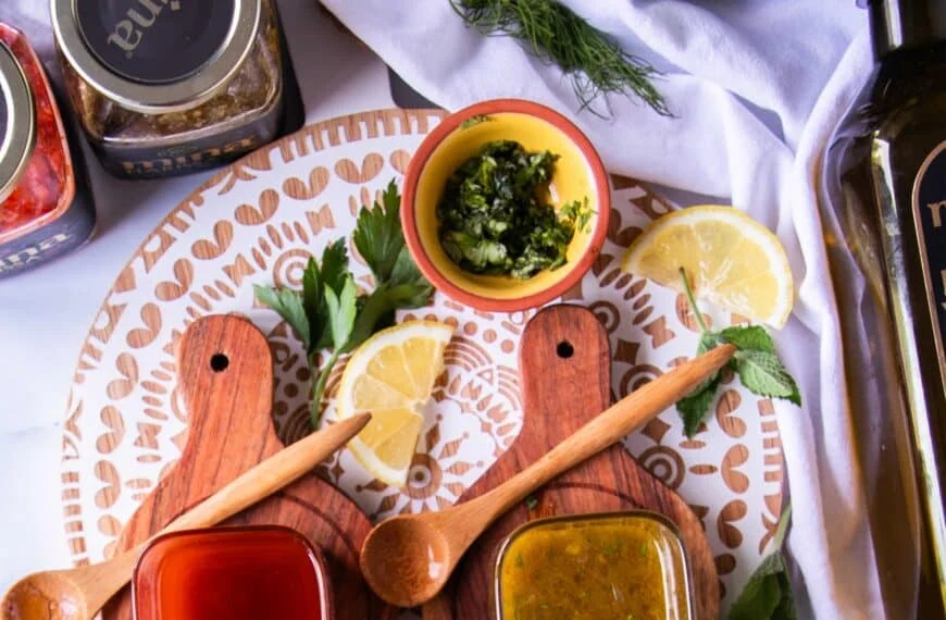 harissa vinaigrette in a bowl surrounded by salad