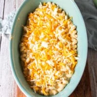 a layer of cheese is layered over half of the pasta