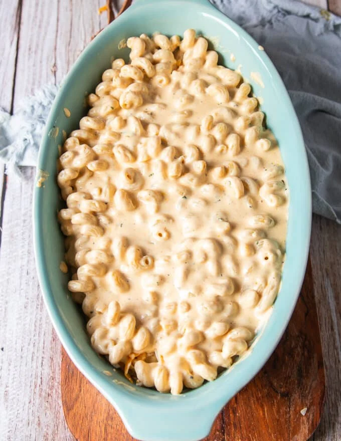 the final amount of pasta is added over the cheese