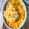 the best mac and cheese recipe showing creamy and luscious pasta in the sauce with cheesy pulls