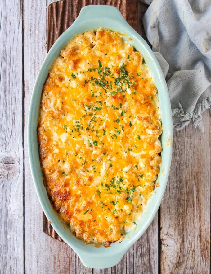 a dish of mac and cheese out of the oven gooey and ready to eat