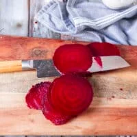 Another option of using a sharp knife to slice the beets for beet carpaccio is shown