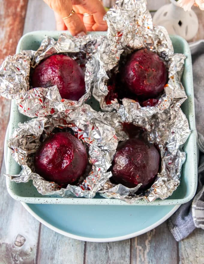 perfect roasted beets in a pan, cooled down and peeled from the foil to make beet carpaccio
