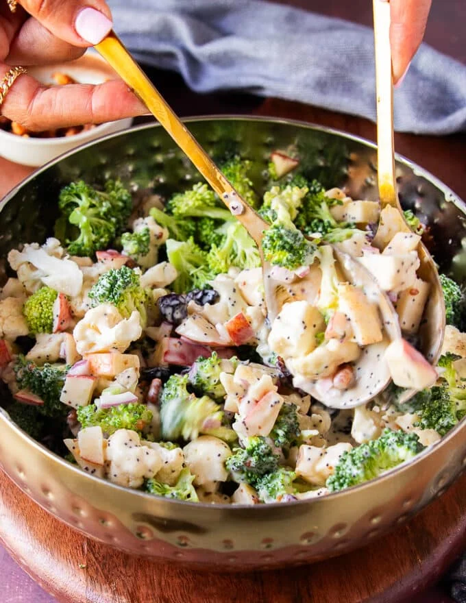 Tossing the salad with the dressing