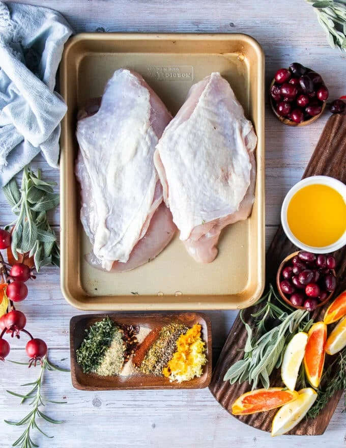 Ingredients needed to make air fryer turkey breast including two turkey breasts some seasoning , melted butter, citrus zests