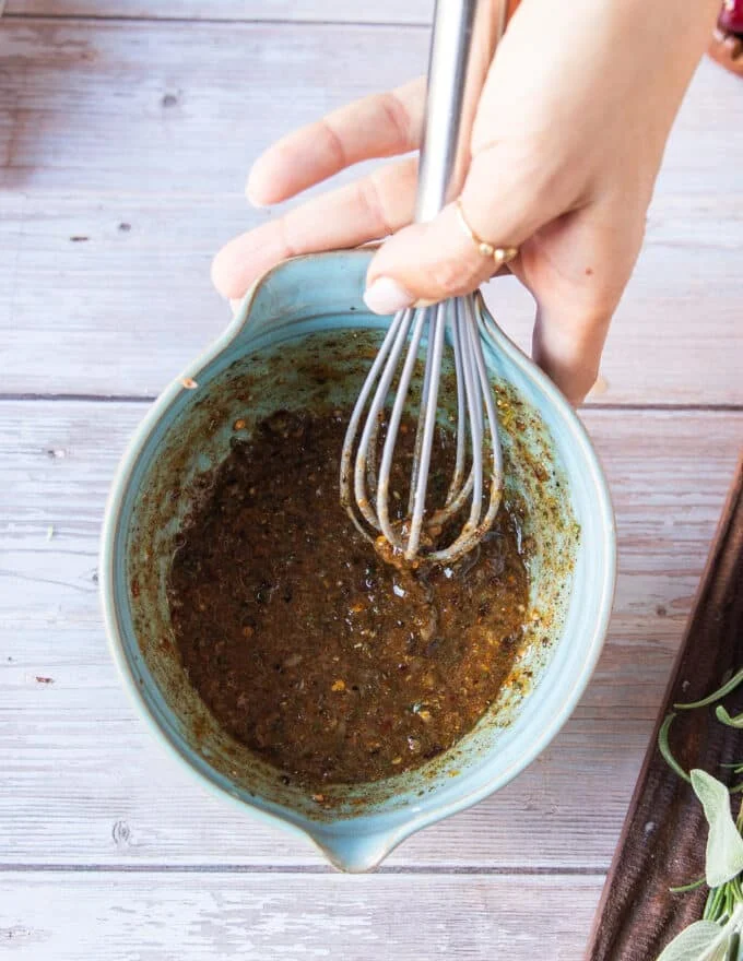 the seasonings and aromatics are mixed in a bowl with. melted butter to slather on the turkey breast before air frying