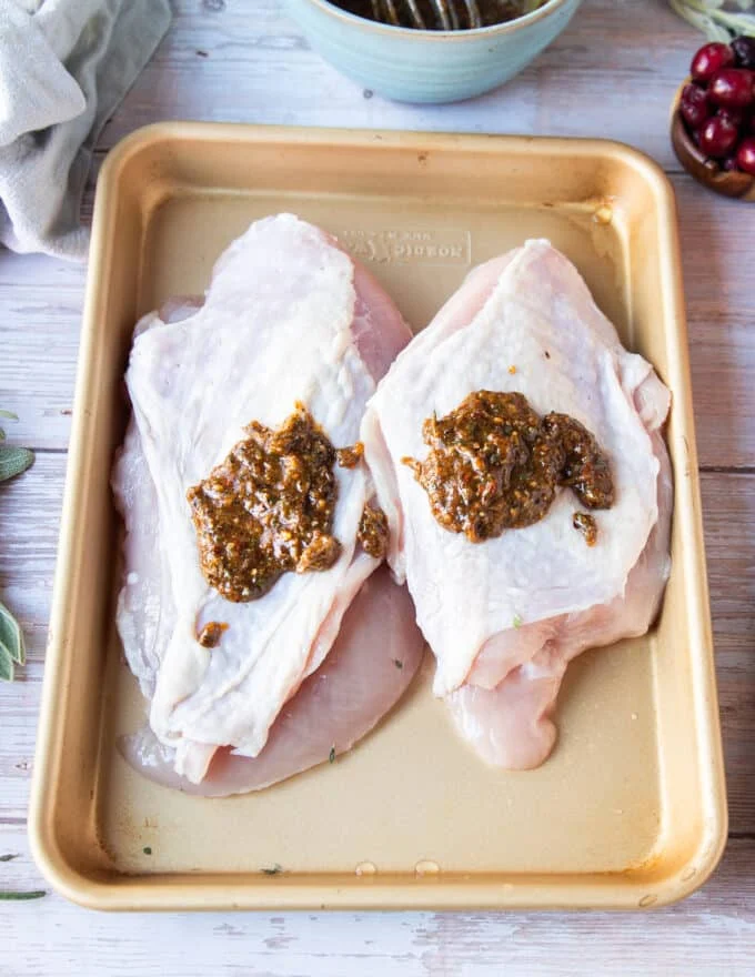 The butter mixture is added to the turkey breast