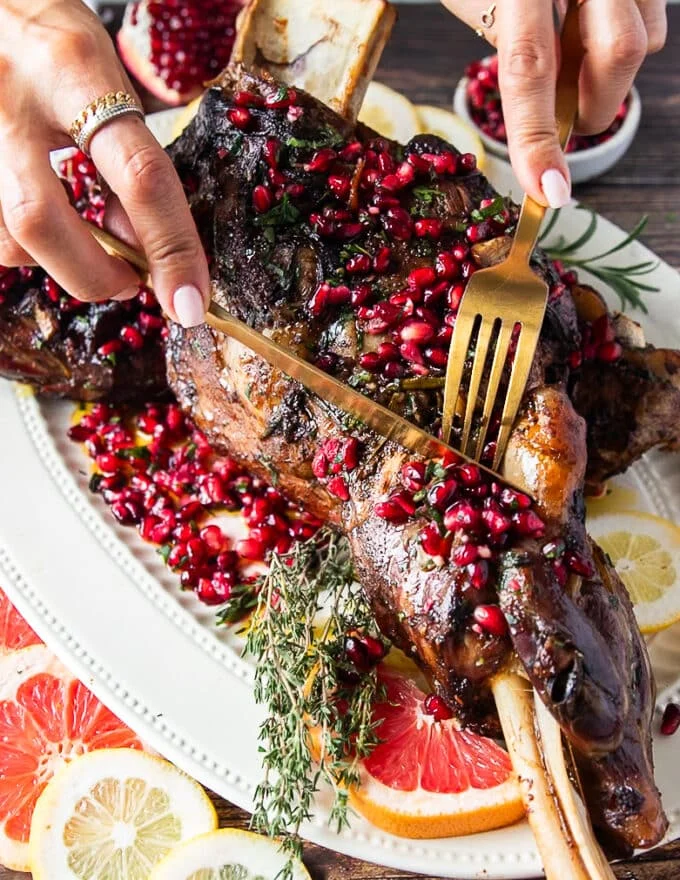 fork and knife cutting through the melt in your mouth tender lamb shoulder recipe