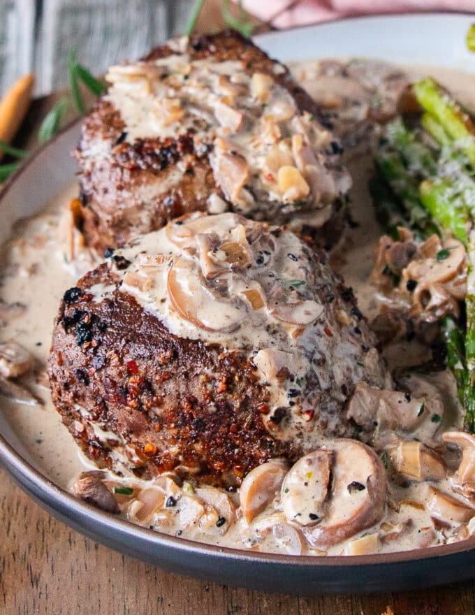 Perfectly cooked filet mignon drenched in creaky mushroom sauce for steak
