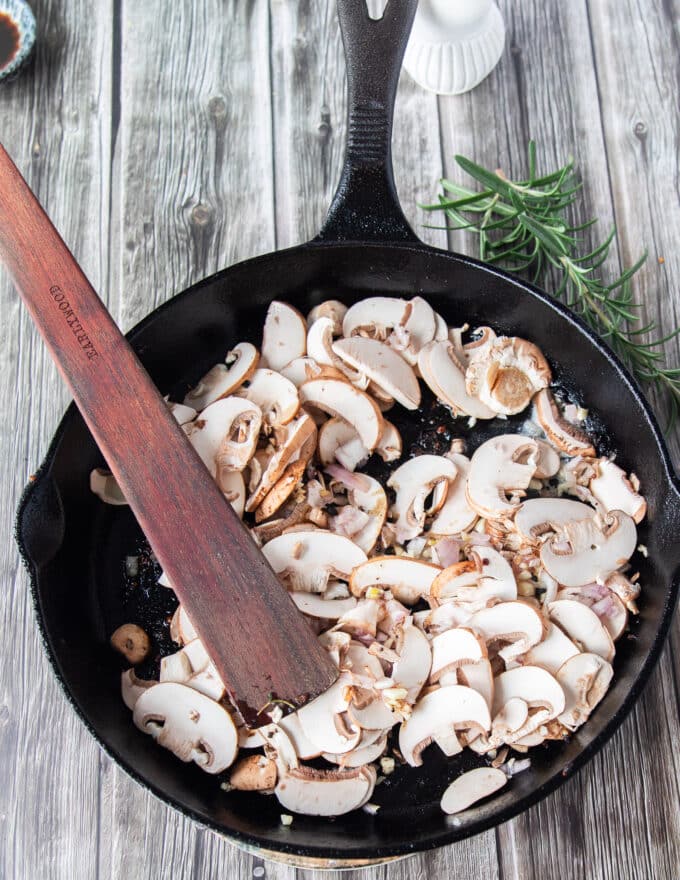 making creamy mushroom sauce for steak, sauteing mushroom in a hot pan
