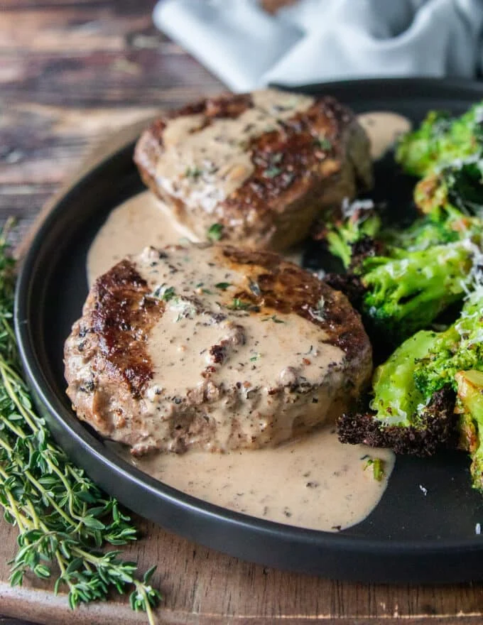 Steak cooked with a rich peppercorn steak sauce