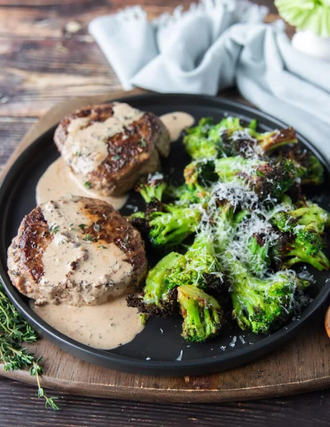 full plate of steak in a peppercorn steak sauce