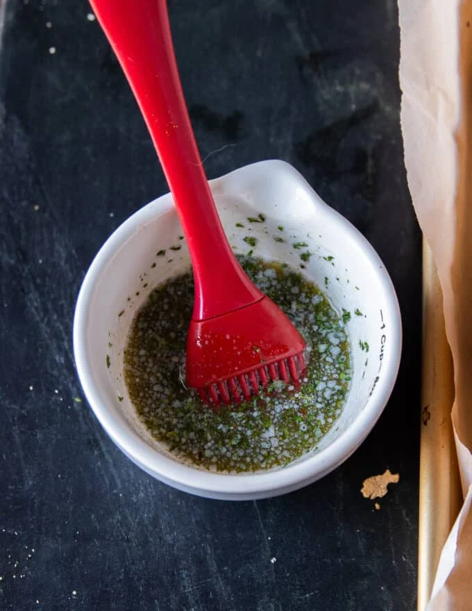 garlic herb butter mixed in a bowl to brush the slider bread buns