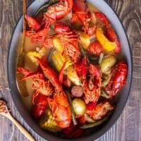 Perfectly cooked large pot of crawfish boil ready to drain and serve