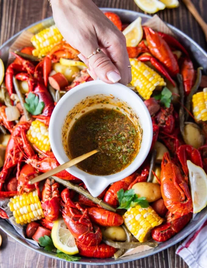 cajun melted butter added on top of the crawfish boil at serving