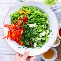 All the snap pea salad ingredients sliced and diced and added to a salad bowl