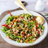 perfect snap pea salad all dressed up with crunchy nuts on top