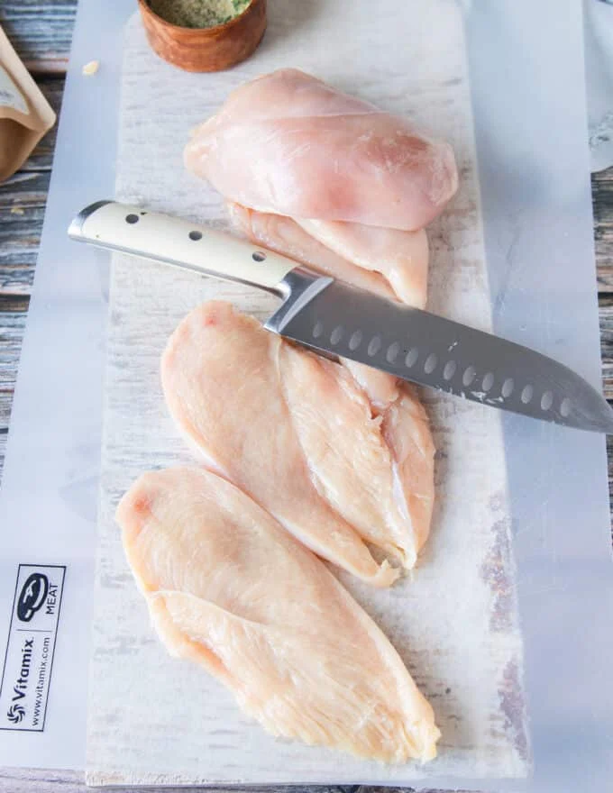 chicken breasts sliced in half to cook