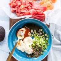The aromatics for the filling like spicy mayo or kewpie, sriracha, soy sauce, green onions and more, are all added to a shallow bowl