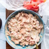 The diced fresh seafood tuna or salmon is added and mixed into the aromatic sauce bowl to make the filling for the sushi cake