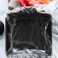 a square cake pan lined with plastic wrap to use for the sushi cake