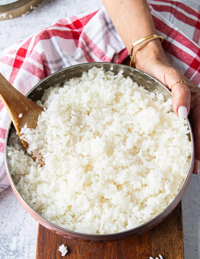 seasoned and folded sushi rice cooling in a bowl