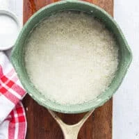 The rice and water placed in a pot ready to cook