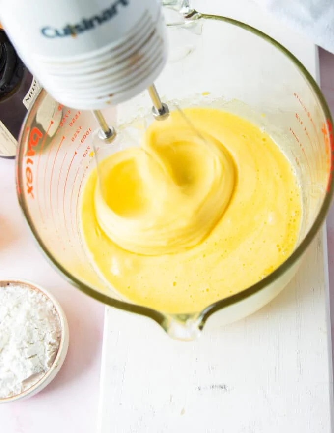 Initial beating of the sugar and eggs and incorporating air into the brownie pudding