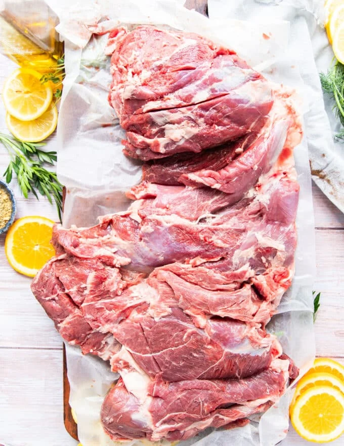 a whole leg of lamb butterflied showing the perfect way to butterfly the leg of lamb
