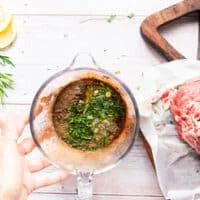 the marinade ingredients added to the bowl of onion water