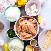 Ingredients Needed to make chicken spiedini including small bowls of ingredients on a large table